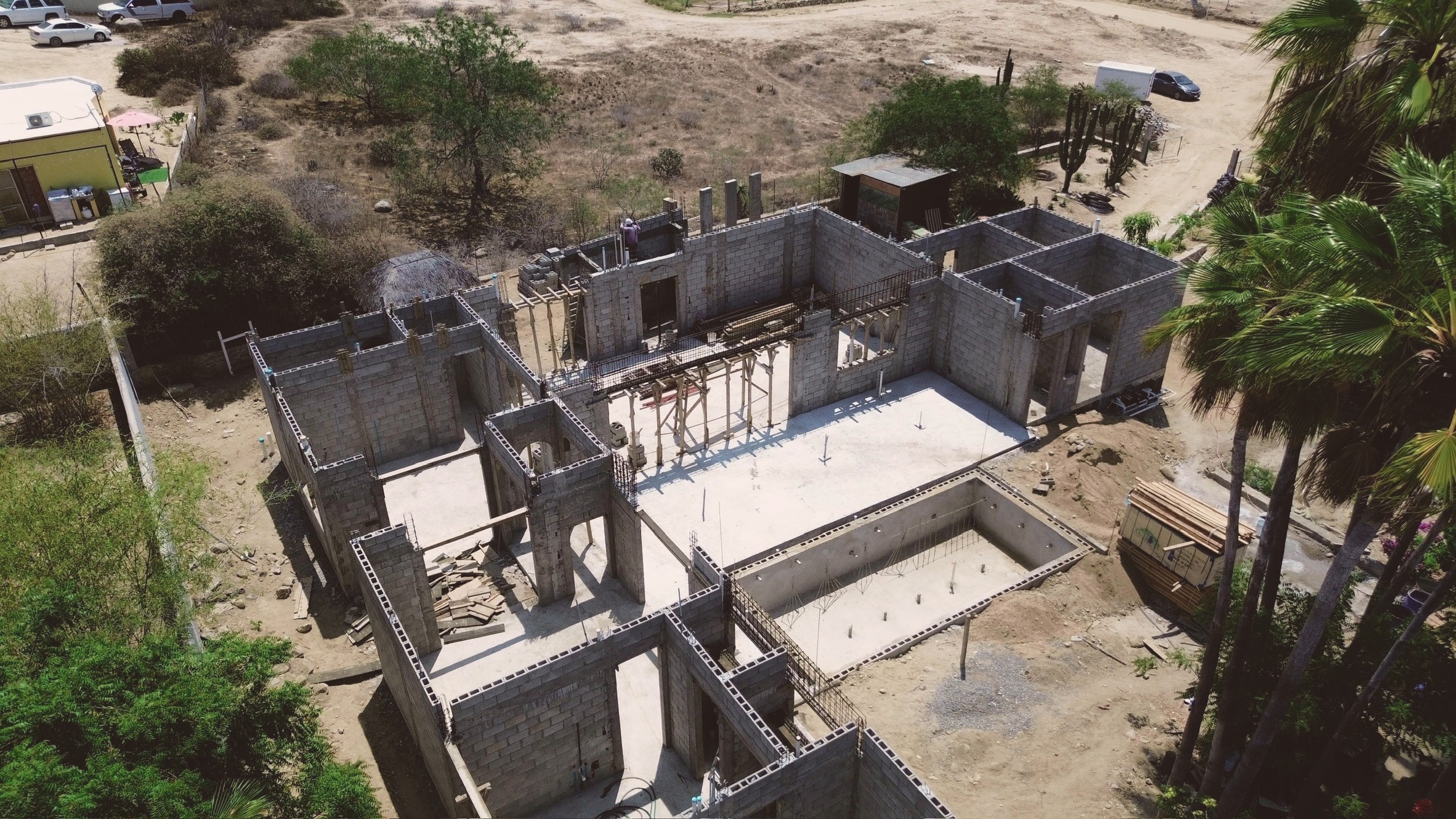 Aerial view of an active construction site near finished homes