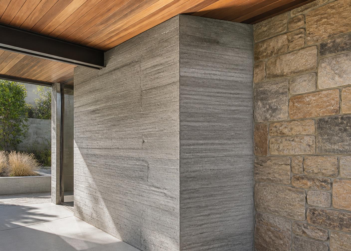 Board-formed concrete, stone and wood detail in a high-end build