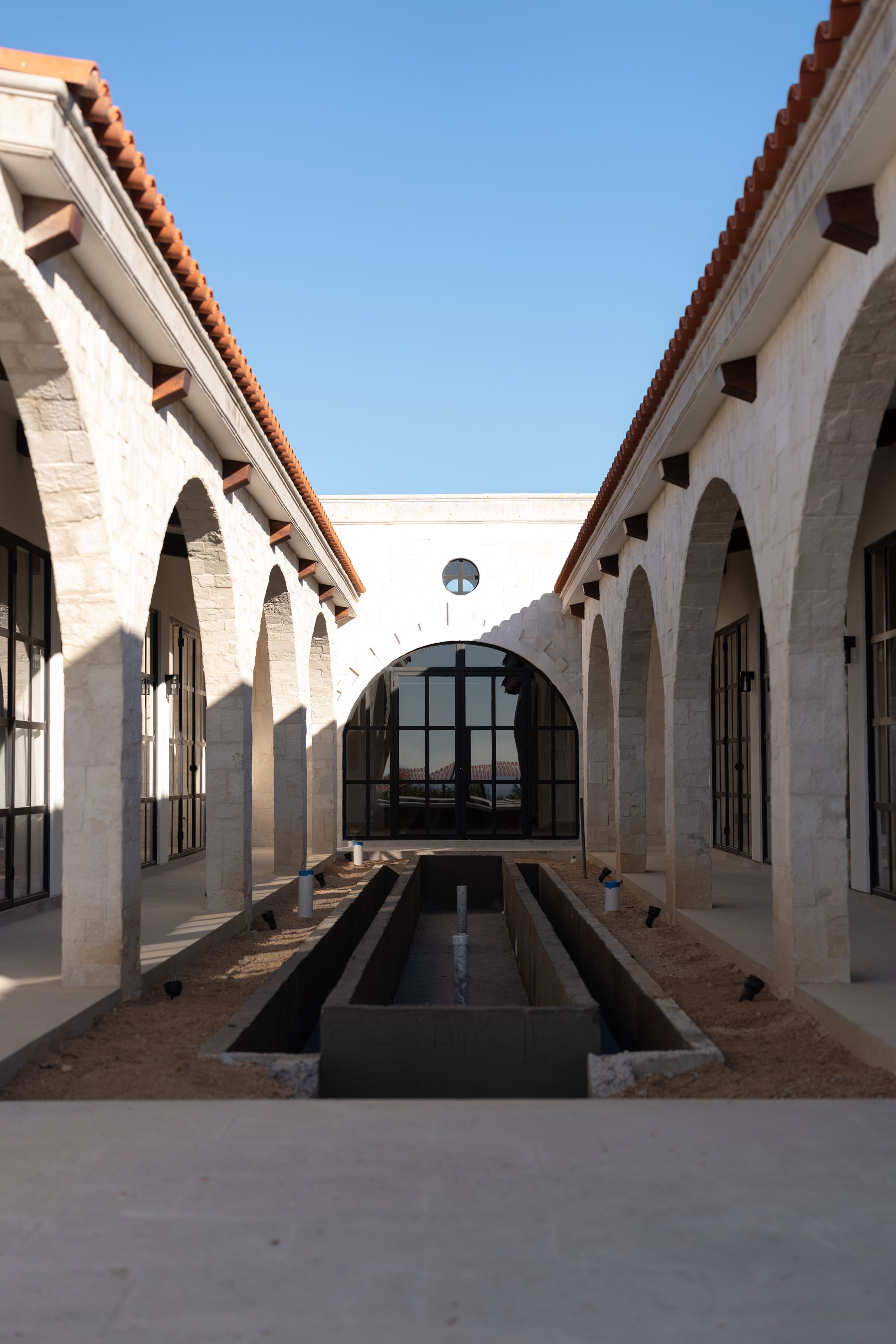 Sunlit stone arcade corridor