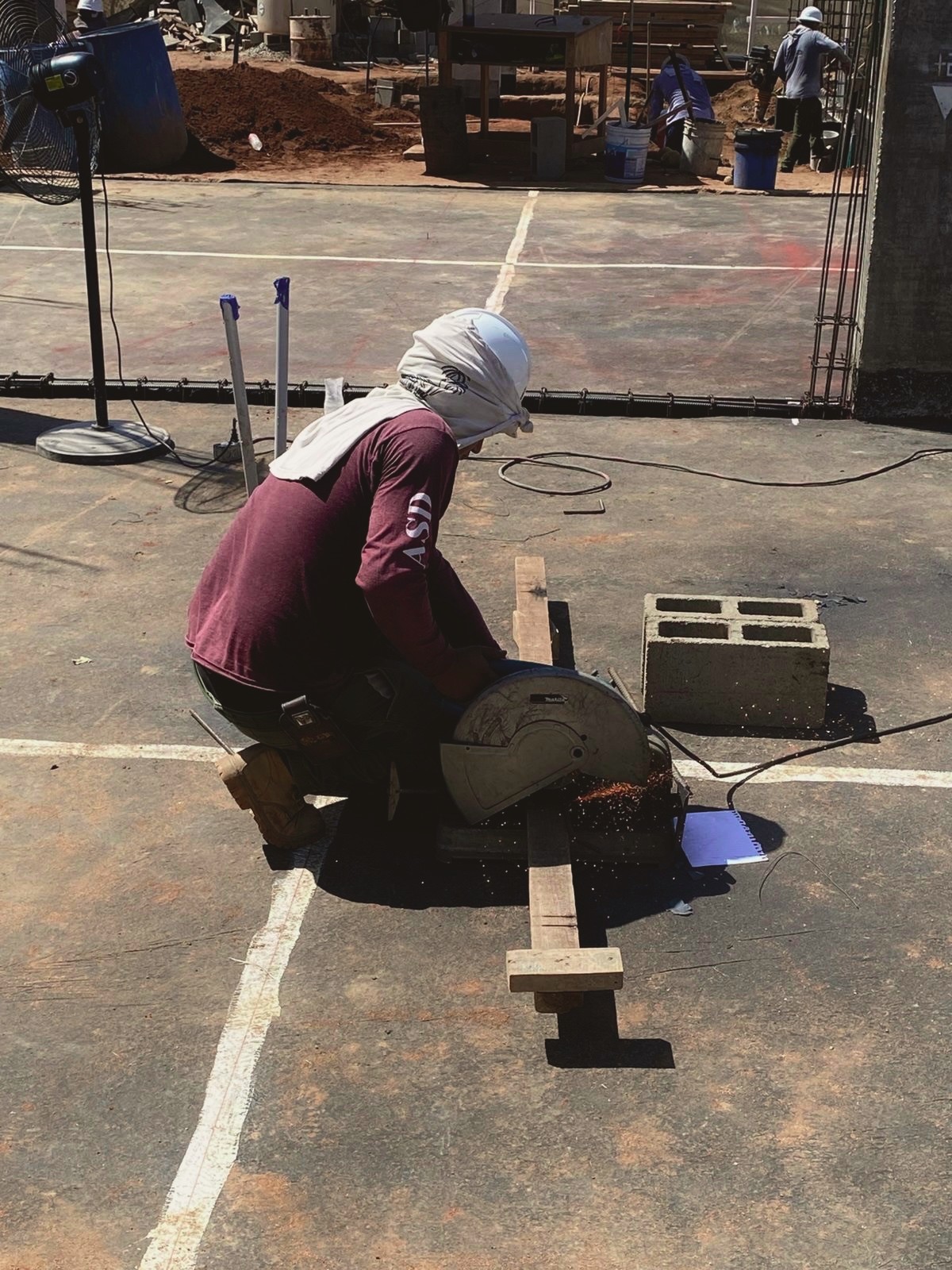 Crew member working on site masonry
