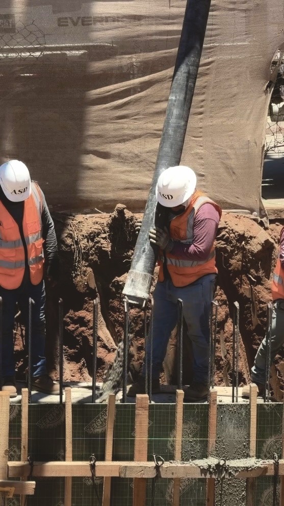 Crew tying rebar on a foundation slab